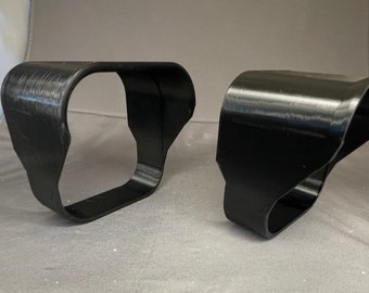 May include: Two black plastic 3D printed vent covers. The vent covers are designed to fit over a rectangular vent opening.
