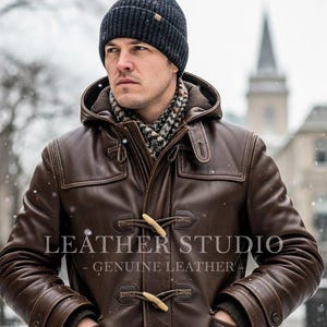 May include: A brown leather duffle coat with a hood and toggle closures. The coat is worn with a black beanie and a patterned scarf. The text "LEATHER STUDIO - GENUINE LEATHER" is visible on the coat.