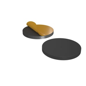 May include: Two round adhesive pads, one with the adhesive backing peeled back to reveal the sticky surface. The pads are black and have a smooth, circular shape.
