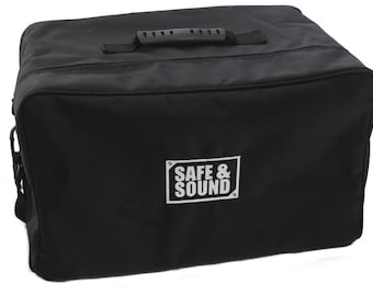 May include: Black padded carrying case with a top handle and a shoulder strap. The case has a white logo that says "SAFE & SOUND".
