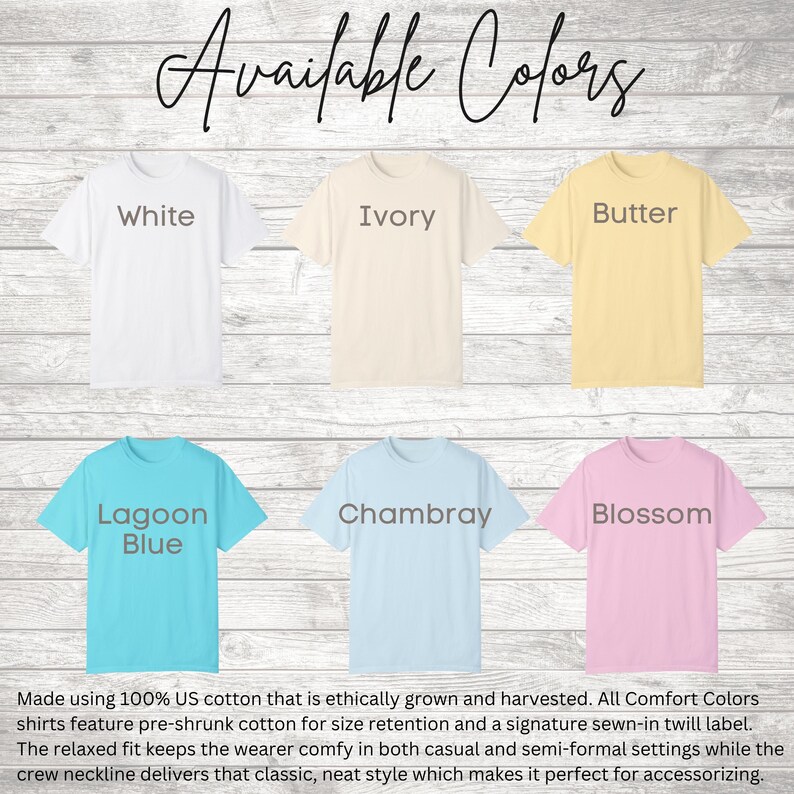 May include: A display of t-shirts in various colors: white, ivory, butter, lagoon blue, chambray, and blossom. The text "Available Colors" is at the top. The shirts are made of 100% US cotton.