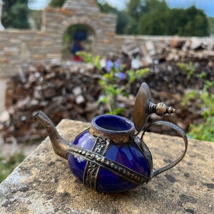 The small vintage Moroccan decorative teapot