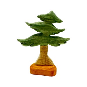 May include: A wooden toy tree with a green painted trunk and branches, and a brown base.