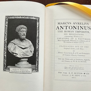 May include: A black and white image of a bust of Marcus Aurelius, a Roman emperor, from the Naples Museum. The image is from a book titled "Marcus Aurelius Antoninus, The Roman Emperor, His Meditations Concerning Himself: Treating of a Naturall Mans Happinesse; Wherein it Consists, and of the Meanes to Attaine unto it." The book was translated from the original Greek by Meric Casaubon, B. of D. and Prebendary of Christ Church, Canterbury. It was edited with an introduction, appendix, and glossary by W. H. D. Rouse. The book was published by E. P. Dutton & Co. in New York and J. M. Dent & Co. in London in 1900.