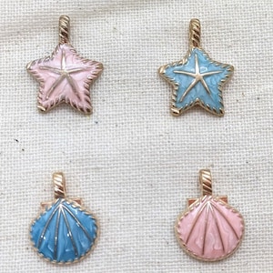 May include: Four gold charms with enamel detailing. Two charms are pink and shaped like starfish, and two charms are blue and shaped like seashells.