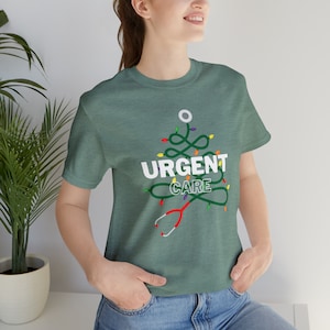 Urgent care christmas tree stethoscope with lights Unisex Jersey Short Sleeve Tee