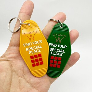 May include: Two yellow and green motel keychains with a butterfly design and the text "Find your special place".