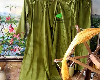 Green silk ao dai embroidered with peach blossoms- Vietnamese traditional long dress