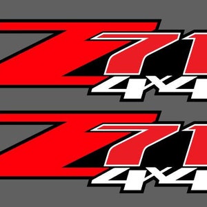 May include: Two red and black decals with the text "Z71 4x4". The decals are designed for vehicles and feature a bold, stylized font.