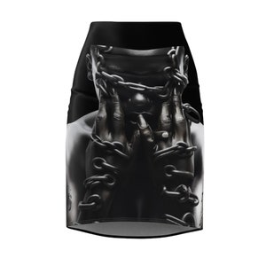 May include: A monochrome mini skirt with a graphic print. The design features a person's face and hands, with chains obscuring the face. The skirt has a high waist and a fitted shape. The image is a grayscale photograph.