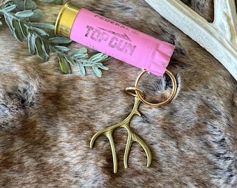 Llavero con forma de cartucho de escopeta rosa calibre 12