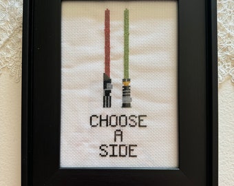 Imagen de punto de cruz de sable de luz de Star Wars