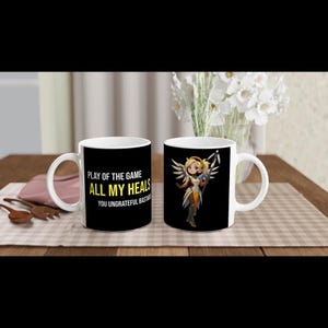 Overwatch Play of the Game Mug – Mercy Moira Kiriko Lucio Illari Wuyong & More – FPS Gamer Gift Cup for Support Mains