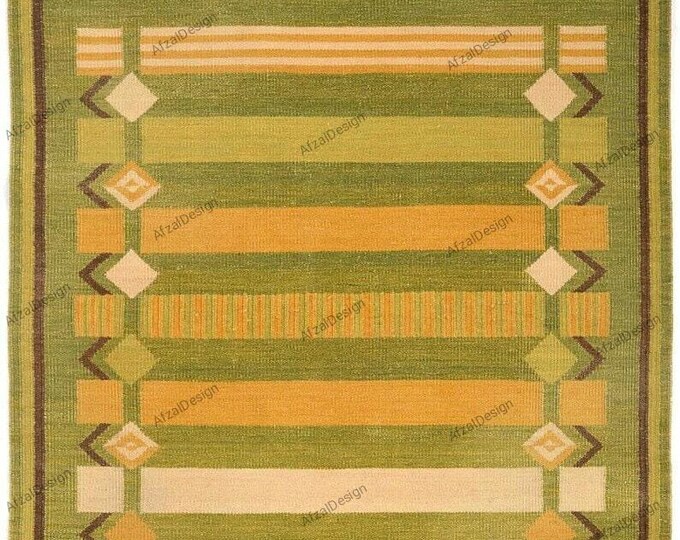 Kilim rug "Swedish Marianne Richter-inspired Dari Kilim rug, handwoven with intricate patterns and a rich olive green color."