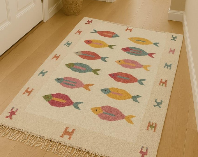Swedish Marianne "Handmade Kids Room Wool Rug – Colorful Fish Motif on Cream Background with Playful Border