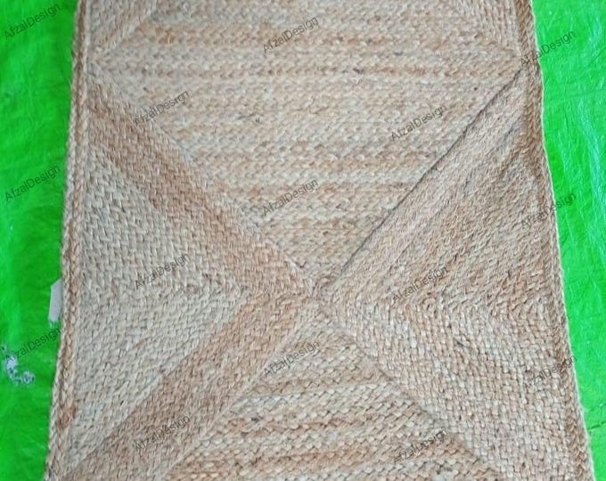 This looks like a handmade jute rug with universal bedecked pattern. Here are some titles for it Handmade Natural Jute Rug Wood Woven Design