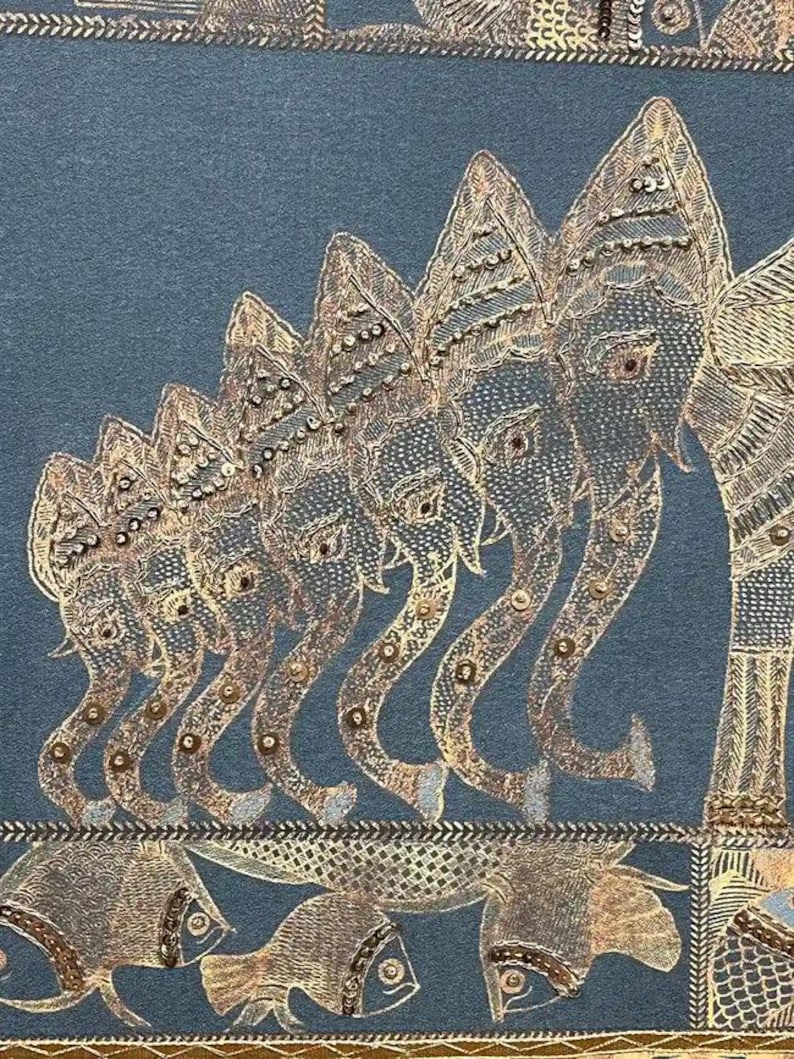 May include: A detailed textile featuring a row of elephants with ornate, embellished designs in gold and silver thread. The elephants are arranged in a line, with their trunks curved. Below the elephants are fish. The background is a muted teal color.