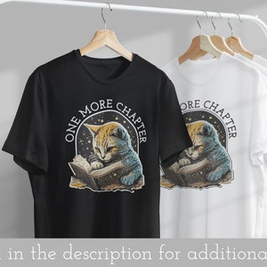 May include: Black and white t-shirt with a graphic of a cat reading a book. The graphic has a starry background and the text "One More Chapter".