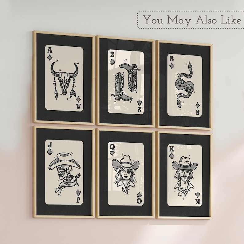 May include: Six framed prints of playing cards with a western theme. The cards are the Ace, 2, 8, Jack, Queen, and King of Spades. Each card features a different illustration, including a bull skull, cowboy boots, a snake, a skeleton, a woman with a bandana, and a cowboy.