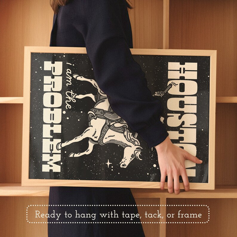 May include: A black and white illustration of a horse with the text "I am the PROBLEM" and "HOUSTON" on a black background. The illustration is framed in a light wood frame.