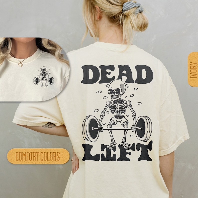 May include: A cream colored t-shirt with a black graphic of a skeleton lifting a barbell. The text "DEAD LIFT" is printed in black above the skeleton.