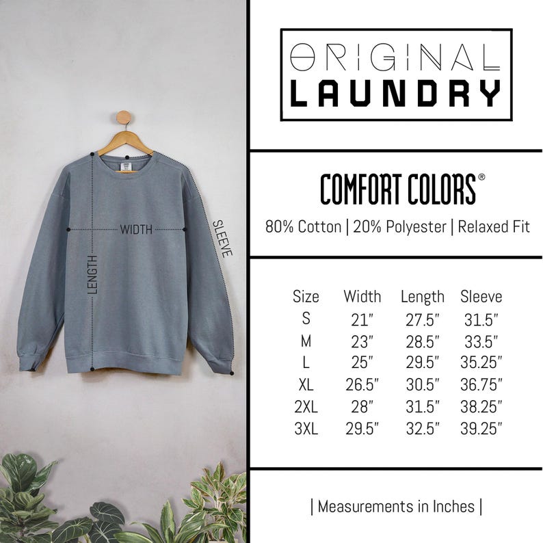 May include: A size chart for a sweatshirt with measurements in inches. The chart shows the size, width, length, and sleeve length for sizes S through 3XL. The sweatshirt is made of 80% cotton and 20% polyester and has a relaxed fit.
