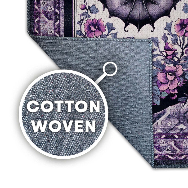 May include: A section of a cotton woven rug with a floral design in shades of purple, black, and cream. The rug's edge is visible, showing a blue backing. The text "COTTON WOVEN" is displayed in a circular inset.