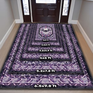 May include: A stack of purple and black patterned rugs in various sizes, from 2x3 ft to 6.5x9.8 ft. Each rug features a central design with a bat and floral elements. The rugs are displayed in a hallway setting.