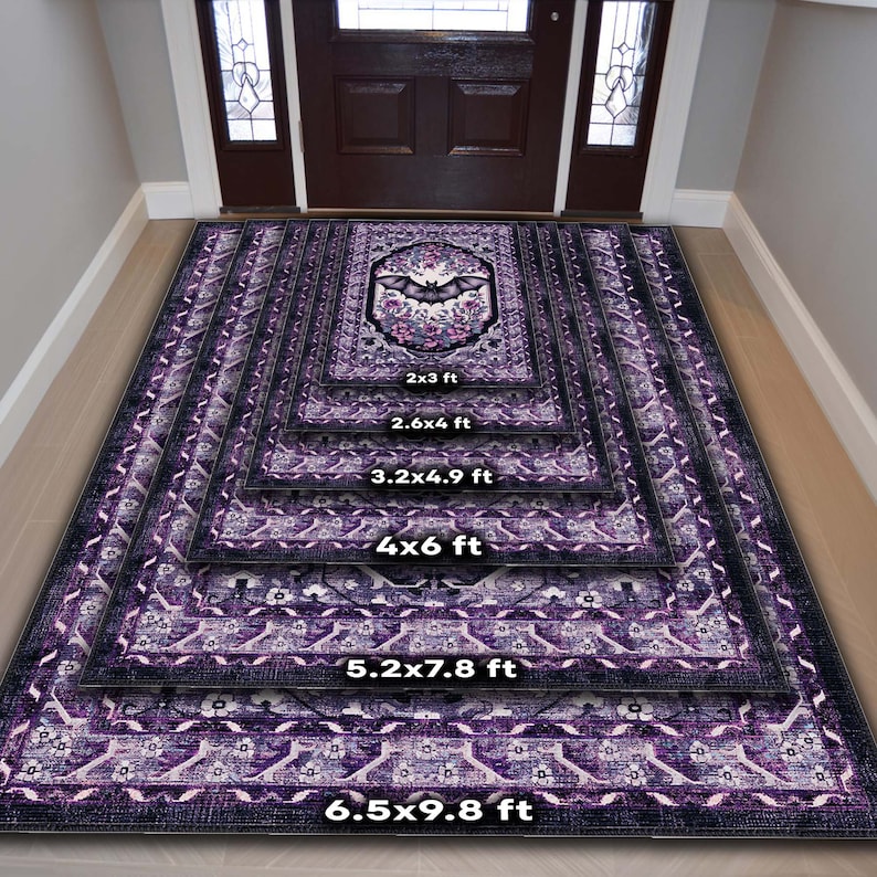 May include: A stack of purple and black patterned rugs in various sizes, from 2x3 ft to 6.5x9.8 ft. Each rug features a central design with a bat and floral elements. The rugs are displayed in a hallway setting.