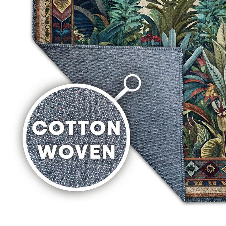 May include: A cotton woven rug with a botanical design featuring lush green and teal foliage, accented with red flowers and a patterned border. The rug's backing is a solid blue-gray color. The words "COTTON WOVEN" are displayed in a white circle.