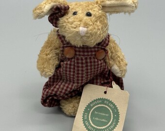May include: A tan plush rabbit wearing red and white checkered overalls with two brown buttons. The rabbit has a small matching bow on its ear and a beige tag attached that reads Boyds Bears The Archive Collection Investment Collectables peter.