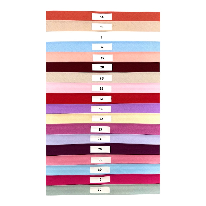 May include: A collection of 17 fabric swatches in various colors, including red, pink, blue, purple, and beige. Each swatch has a number printed on it, ranging from 1 to 80.