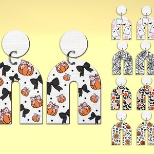 May include: Set of 10 pairs of Halloween-themed earrings. Each pair features a different design, including pumpkins, ghosts, spiderwebs, and leopard print. The earrings are made of wood and have a white background.
