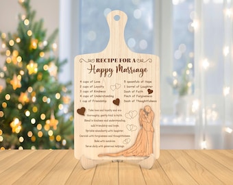May include: A wooden cutting board with a recipe for a happy marriage engraved on it. The recipe includes ingredients like love, loyalty, kindness, understanding, and friendship. The board also features a couple holding hands.