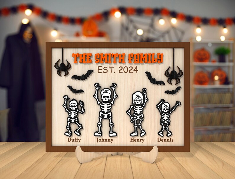 May include: A wooden sign with a black and white Halloween theme. The sign says "The Smith Family Est. 2024" and features four skeletons with names: Duffy, Johnny, Henry, and Dennis.