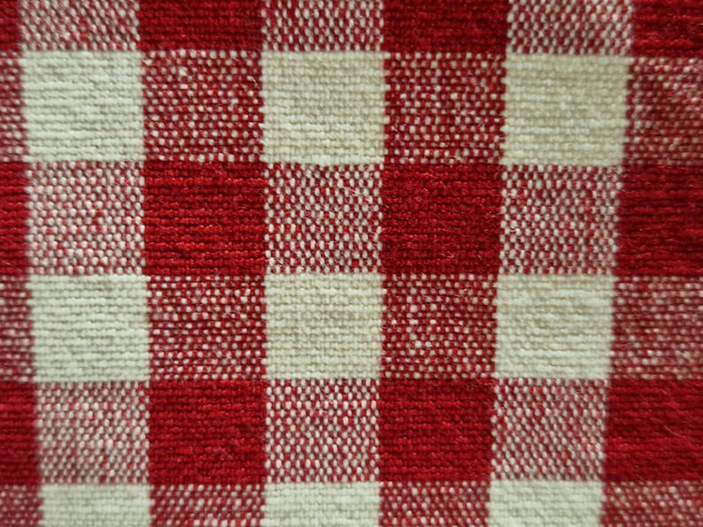 close up photo of a beautiful gingham red checked fabric for a cotton clothes page bag.