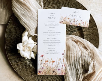 May include: A wedding menu with a floral design. The menu includes appetizers, starters, main course, desserts, and a wedding cake. The table number is 2 and the name is Olivia.