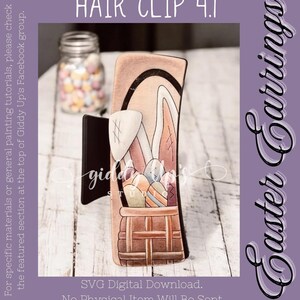 May include: A wooden hair clip shaped like a bunny holding a basket of colorful Easter eggs. The clip is 4.1 inches long and is a digital download, no physical item will be sent.