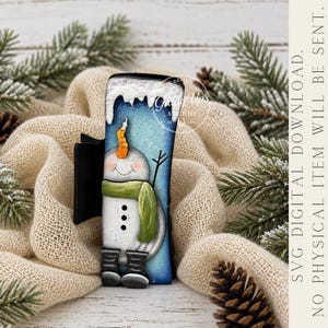 May include: A rectangular hair claw clip featuring a snowman illustration with a carrot nose, green scarf, and black boots against a blue gradient background with white snow accents. Text reads: SVG DIGITAL DOWNLOAD. NO PHYSICAL ITEM WILL BE SENT.