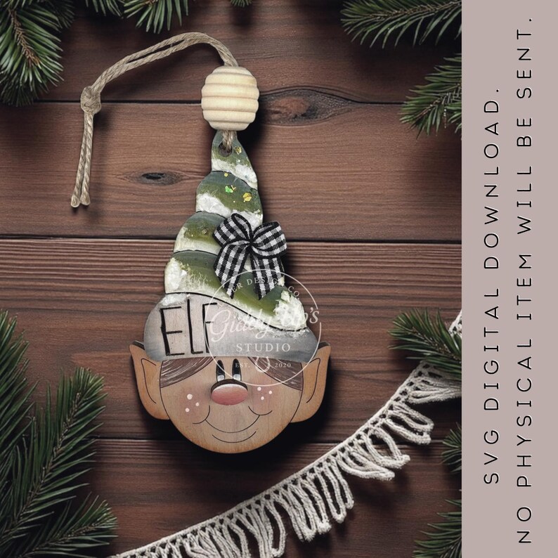 May include: Wooden elf Christmas ornament with a painted face, a green and white hat, and a black and white checkered bow. The ornament has a string for hanging and the word "ELF" is visible. The text "SVG DIGITAL DOWNLOAD. NO PHYSICAL ITEM WILL BE SENT." is also visible.