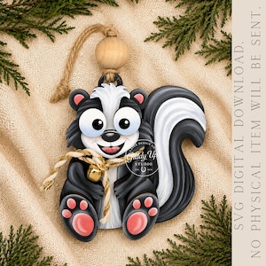 May include: A wooden skunk ornament featuring a black and white design with large eyes, a pink tongue, and pink paw pads. It includes a jute rope hanger with a wooden bead and a gold-colored bell. Text reads: SVG DIGITAL DOWNLOAD. NO PHYSICAL ITEM WILL BE SENT.