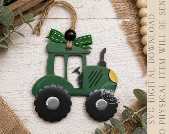 May include: A green wooden tractor decoration with black wheels and a yellow headlight. It features a green bow and a black bead for hanging. The text "SVG DIGITAL DOWNLOAD. NO PHYSICAL ITEM WILL BE SENT." is visible.