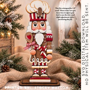 May include: A gingerbread-themed nutcracker figure wearing a chef hat with a small gingerbread man on top. The figure holds a wooden spoon with a red heart and a red-and-white striped sleeve. Text states: This file is designed for 1/8" wood.