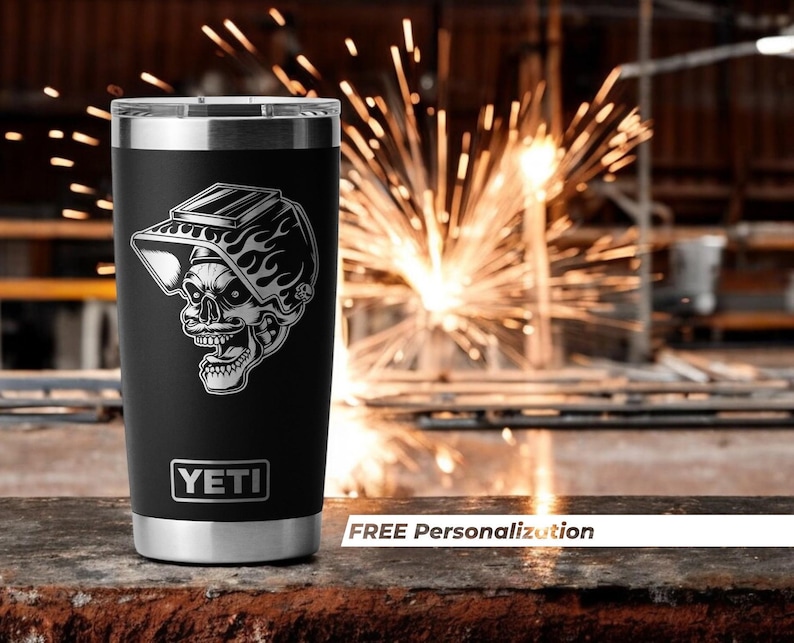 a black yeti tumbler with a welder laser engraved design on it