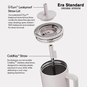 May include: An exploded view of the Era Standard tumbler featuring a light gray &Uuml;-Turn leakproof straw lid, a clear circular lid component, and a removable ColdKey stainless steel straw. The tumbler body is light gray with a side handle.
