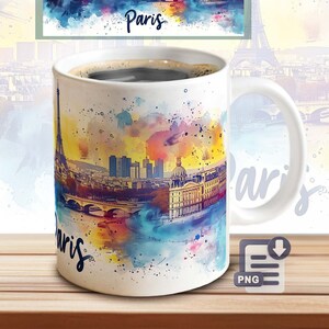 May include: White ceramic coffee mug with a watercolor design of the Eiffel Tower and the Paris skyline. The mug has a black handle and says "Paris" on the front.