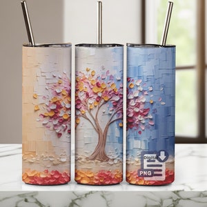 May include: Three cylindrical tumblers with metal straws, each featuring a textured impasto-style painting of a tree with colourful leaves. The designs transition from warm beige to light blue tones, with fallen petals at the base. A Digital PNG icon is visible.