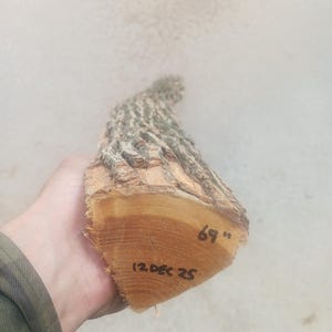 May include: A rustic wooden sign with the text "Welcome to our home" in a handwritten style. The sign features a distressed finish and a simple, inviting design, perfect for a front porch or entryway.