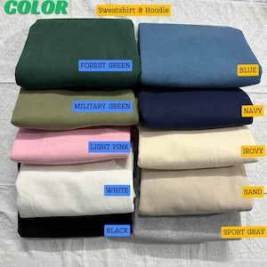 May include: A variety of colors of sweatshirt and hoodie fabric swatches. The colors are forest green, blue, military green, navy, light pink, ivory, white, sand, black, and sport gray.