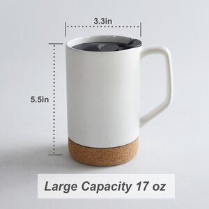 May include: White ceramic mug with a cork base and a black lid. The mug has a handle and measures 5.5 inches tall and 3.3 inches wide. It has a capacity of 17 ounces.  Large Capacity 17 oz
